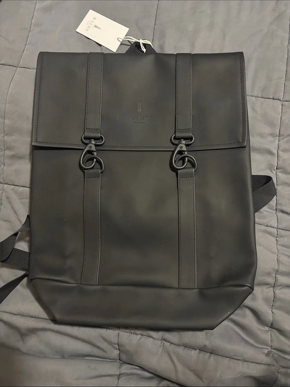 Rains Black Matte Rolltop Backpack with Buckle Straps